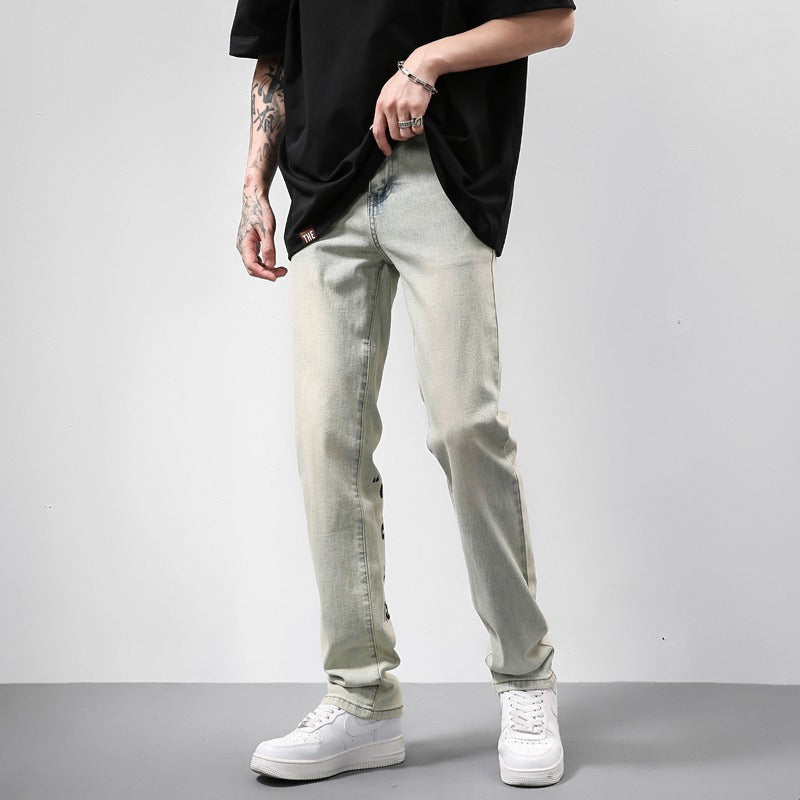 Американские винтажные джинсы с потертостями и желтым грязевым принтом